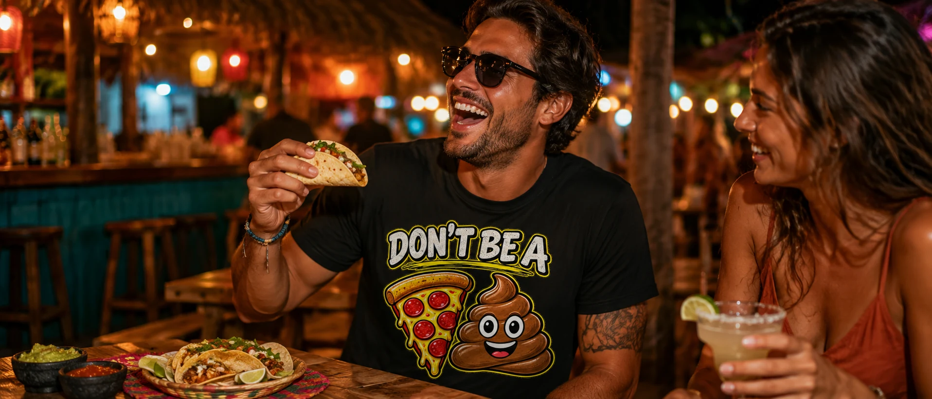 Your Vacation Shirts Suck Friends laughing over tacos while wearing a funny pizza graphic shirt